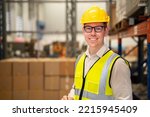 Small photo of Worker portrait smiling happy with job, Male worker wearing equipment safety vest, safety hamlet. Happy worker, Staff smiling to camera at warehouse workplace.