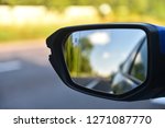 Car mirror with blind spot warning. The car with blind spot monitor which detects other vehicles on the side.