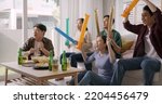 Small photo of Group of young adult friend man and woman asia people sit at sofa couch joy chanting party fun game FIFA world cup live TV at home eat snack bowl drink beer bottle glass jump mad happy win exult face.