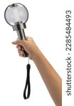 Small photo of Hand Holding K pop light stick isolated on white background, Hand Holding light stick on white Background With clipping path.