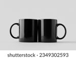 Black coffee mug mockup on a grey background.