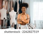 Male stylist Successful Fashion Business. Portrait of Smiling Black Designer stylish standing and working at fashion studio.Portrait of fashion designer in office.