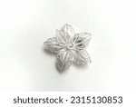 Small photo of Vintage filigree silver brooch of flower isolated on white background