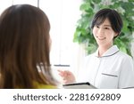 Small photo of Image of an esthetician or nurse giving a counseling session