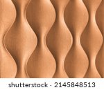 Light brown 3D interior decorative wall panel with unusual wavy geometric shape. Wooden beige background with wave pattern. Abstract texture ornate. Bronze backdrop