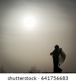 silhouette of muslim woman with ... | Shutterstock . vector #641756683
