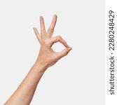 Woman's hand making ok sign...