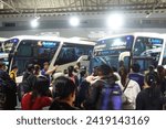 Small photo of Bangkok-Thailand, November 18, 2023: Large crowd of people waiting to get on a bus in Mo Chit or Morchit Bus Terminal station transit hub center, a transportation hub to northern and east-north region