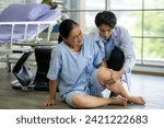Small photo of The physical therapist is assisting a patient in a wheelchair, and an accident occurred resulting in a fall. The patient sustained injuries to the ankle and a broken leg.