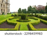 Ornate and well kept garden maze seen at a once stately home now a luxury hotel in the UK.