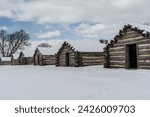 Snow covered log cabins at Valley Forge Historical Park