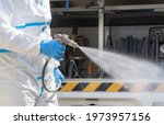 Small photo of Cleaner protection COVID-19 area scourge, spraying disinfectant, germicide.