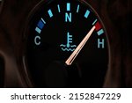 temperature gauge in car dashboard in illuminated night mode - hot