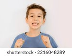 Small photo of junior high school student takes care of teeth. hygiene concept for children. boy flossing his teeth. soft thread of floss silk or similar material used to clean between the teeth