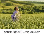 Small photo of Joyous senior woman exploring a beautiful meadow, highlighting the appeal of nature tourism for seniors