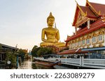 Small photo of Wat Paknam Bhasicharoen tapinagi icindeki Big Buda. Chao Phraya river canal cruise. Tourists traveling by traditional boats. Bangkok most important travel area