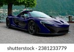 Small photo of Como, Italy - October 28, 2023: Trip to the lake with a deep blu McLaren P1 supercar. Beautiful landscape of Lake Como.