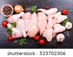fresh chicken meat on dark board, top view.