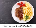 Plate Of Grilled Meat With...