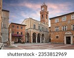 Pienza, Siena, Tuscany, Italy: the main square with the ancient city hall and the beautiful water well of the picturesque medieval town

