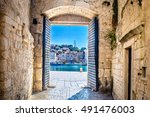 View at city gate in old mediterranean town Trogir, Croatia Europe. / City gate Trogir. / Selective focus.