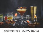 Small photo of Espresso martini, cocktail shaker, accessories in background, dark backdrop, sophisticated drink, alluring presentation