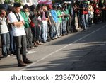 Small photo of Makassar, Indonesia - March 29, 2012: HMI student groups are holding congregational prayers in the middle of a demonstration on Jalan A.P. Pettarani Makassar city