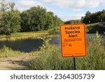Invasive species zebra mussels warning sign at Pine River boat landing in north central Minnesota.