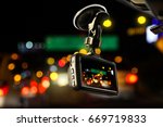 Small photo of CCTV car camera for safety on the road accident on abstract blurred bogey light of city in night background.