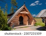 Shepherd's hut on Baligowka in Czarny Dunajec. and surroundings. Wooden mountain hut in the green field. 