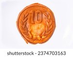 Small photo of Close up on a pancake shaped like a Japanese 10 yen coin which is a chewy dough full of cheese modelled on the edible 10 won coins known as Golden 10-Won Bread that have become popular in South Korea.