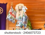 Small photo of Kagura dance performed by the Inari fox deity holding suzu bells and a gohei wand which have the power to exorcise and purify evil spirits during the Konpira festival of Toranomon Kotohiragu shrine.