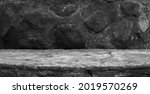 Small photo of A Concrete Moulding, Showing a Very Old Semi Circle Base with Imprints and Grit to the Surface, For a Product Display with a Natural Stone Blurred Foreground and Background.