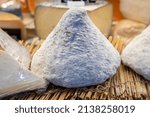 Small photo of French cheese cone shaped port aubry on farmer market