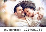 Small photo of Your embrace is the most important thing to me. Happy young couple in bed. Close up.