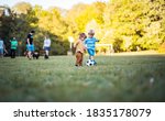 Small photo of Foot ballplayers. Two little boys playing football.