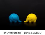 tow yellow and blue elephants... | Shutterstock . vector #1548666830