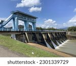 Small photo of A water dam with a blue bridge. The building was designed to correlate the region and to the local rice paddies.sukoharjo_indonesia-may01th2023