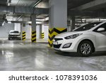 White Cars parked on underground parking. HDR photo