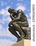Small photo of The statue The Thinker 1904 by Auguste Rodin on display at the Frederik Meijer Gardens and Sculpture Park in Grand Rapids Michigan MI USA. Created 07.18.23