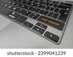 Small photo of Keep Grindin' written on laptop keyboard extreme closeup