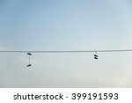 Shoes On The Wire In Blue Sky