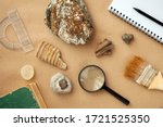 Stone samples, loop, notebook at geological laboratory. Geology rock laboratory. Laboratory for analysis of geological soil materials, stones, minerals, rocks samples for researchers- Brushing sample