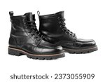 Pair of black leather boots, dress boots for men, men ankle high boots. Man's legs in black jeans and brown leather boots.