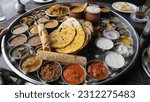 Small photo of The Curry 38 Items Thali Indian Restaurant Food - Mumbai Biggest Thali - Food platter - Best Indian Street Food in Mumbai, Maharashtra India