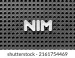 Small photo of White alphabet letter in word NIM (Abbreviation of Net interest margin) on black pegboard background