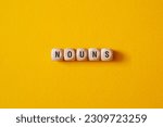 Small photo of Nouns - word concept on cubes, text, letters