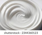 A Closed-Up Shot of Swirling White Facial Cream