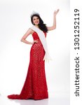 Small photo of Full Length of Miss Pageant Contest in Asian Red Sequin Evening Ball Gown dress with Silver Diamond Crown Sash, fashion make up face hair style, studio lighting white background isolated copy space