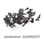 Small photo of Fastener plastic clip fly explosion, black automobile fastener clip float explode, abstract cloud fly. automobile plastic fastener clip splash throwing in Air. White background Isolated